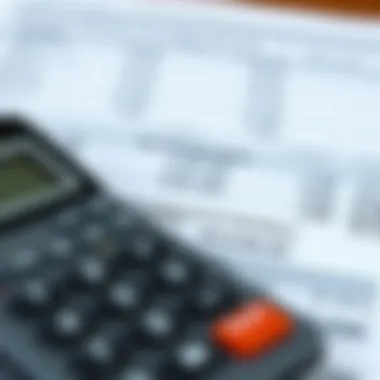 A calculator and financial reports indicating income and withholdings