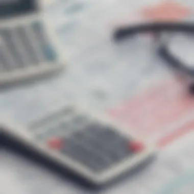 Calculating Tax Implications A calculator and financial papers indicating calculations