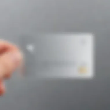 A sleek Apple Card placed on a reflective surface